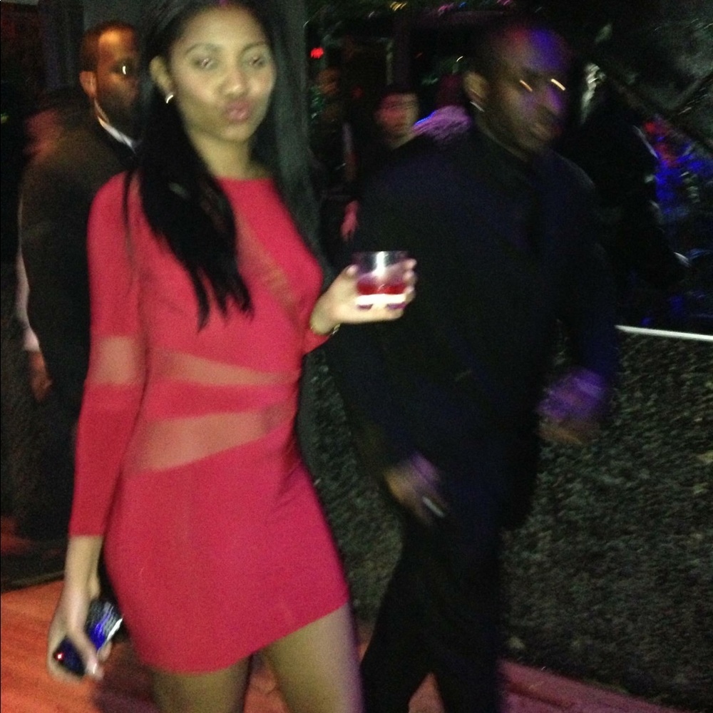 Red party dress with sheer cut outs.